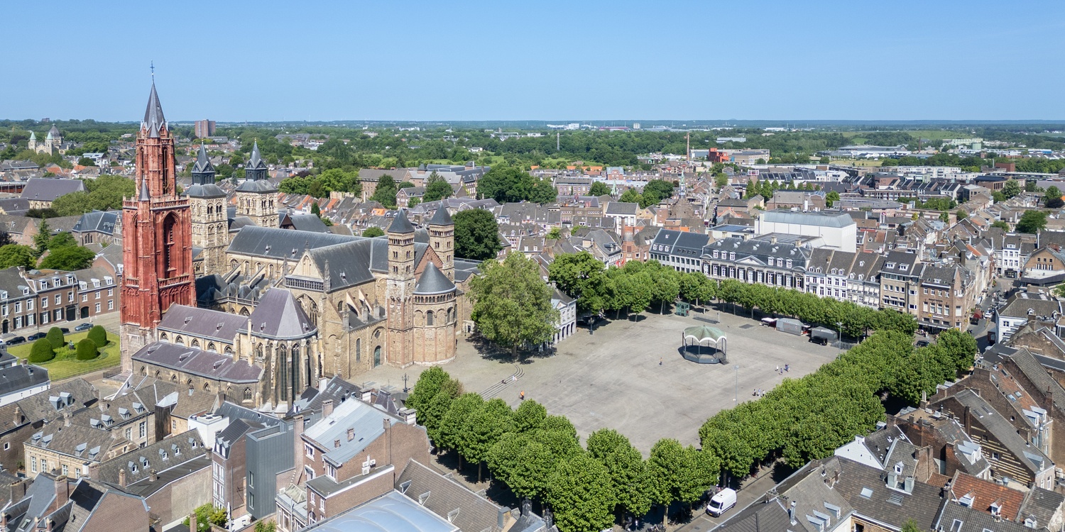 The Vrijthof in Maastricht on a sunny day, on the Vrijthof there are various colored buildings